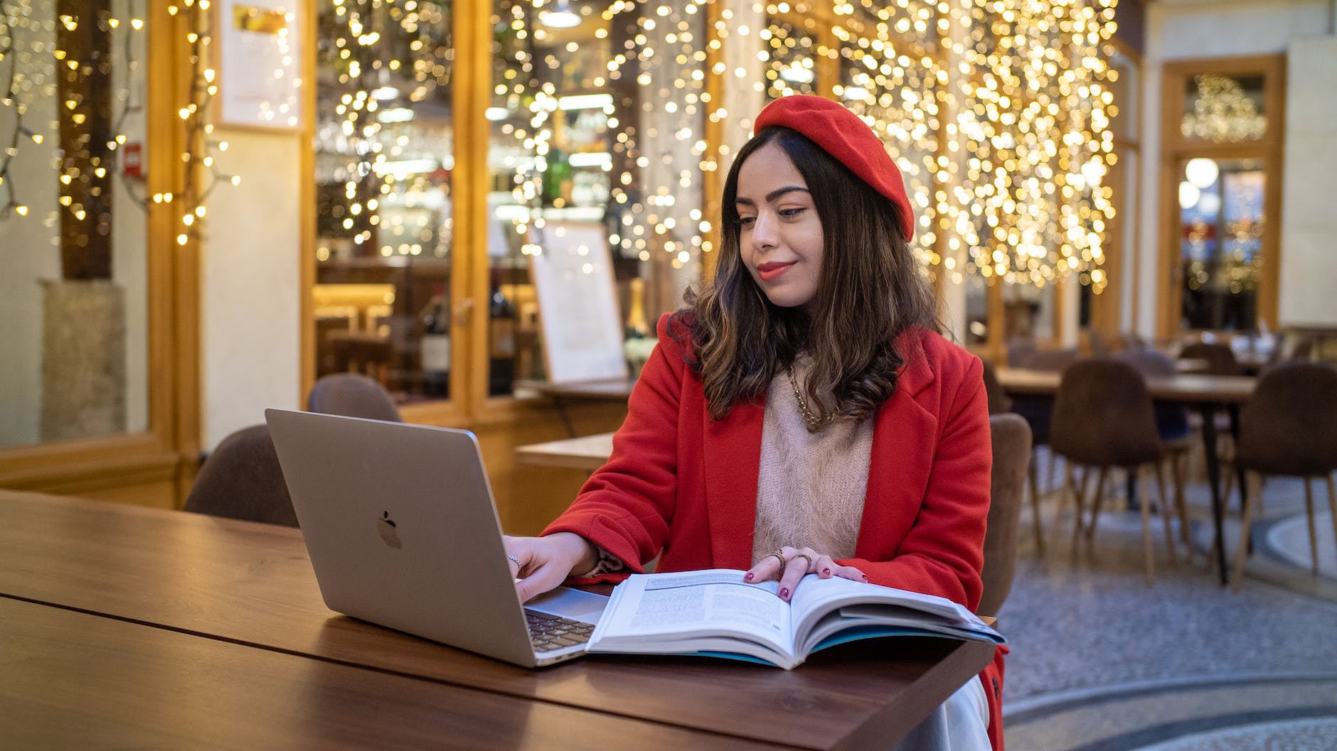 smiling student in red beret