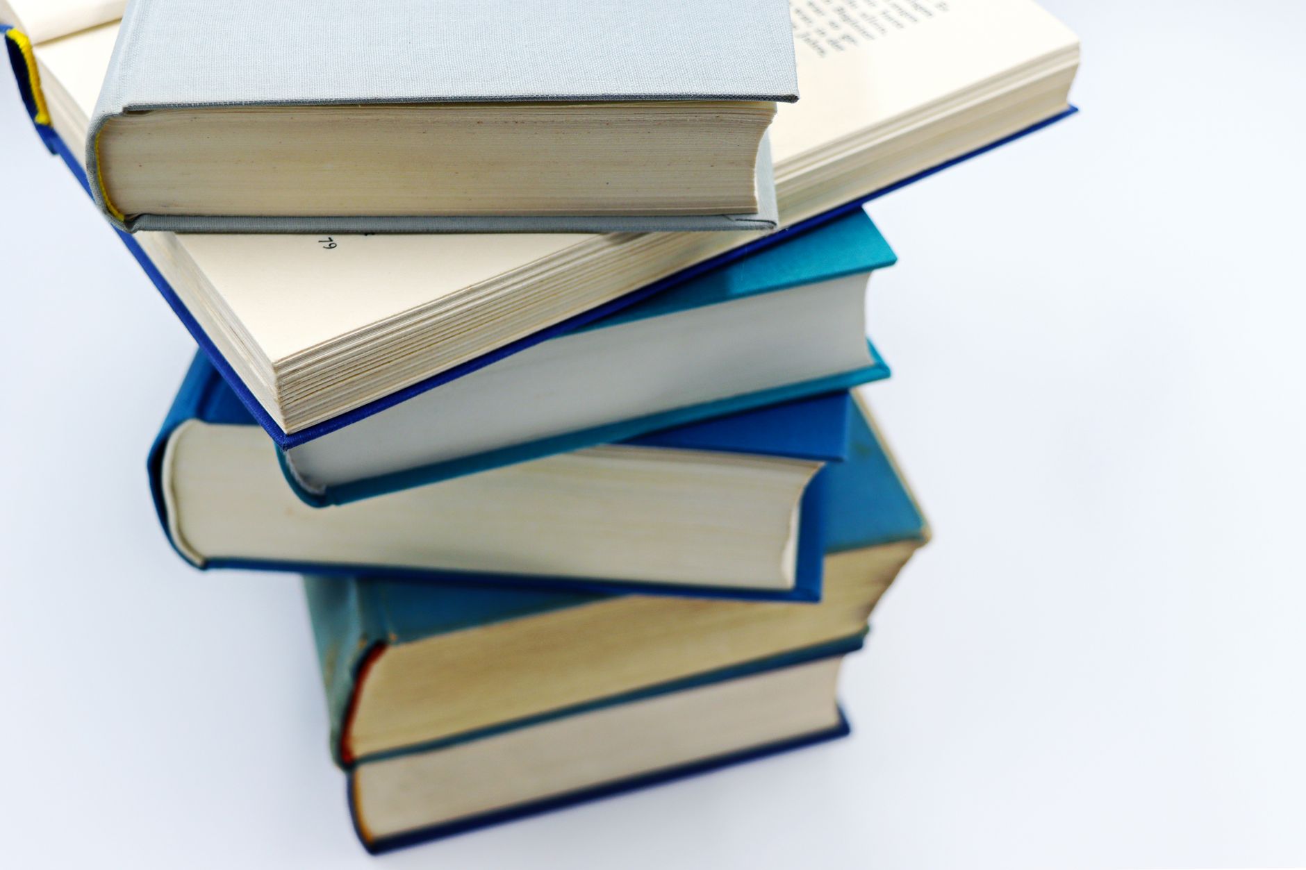 stack of books with blue covers on white background